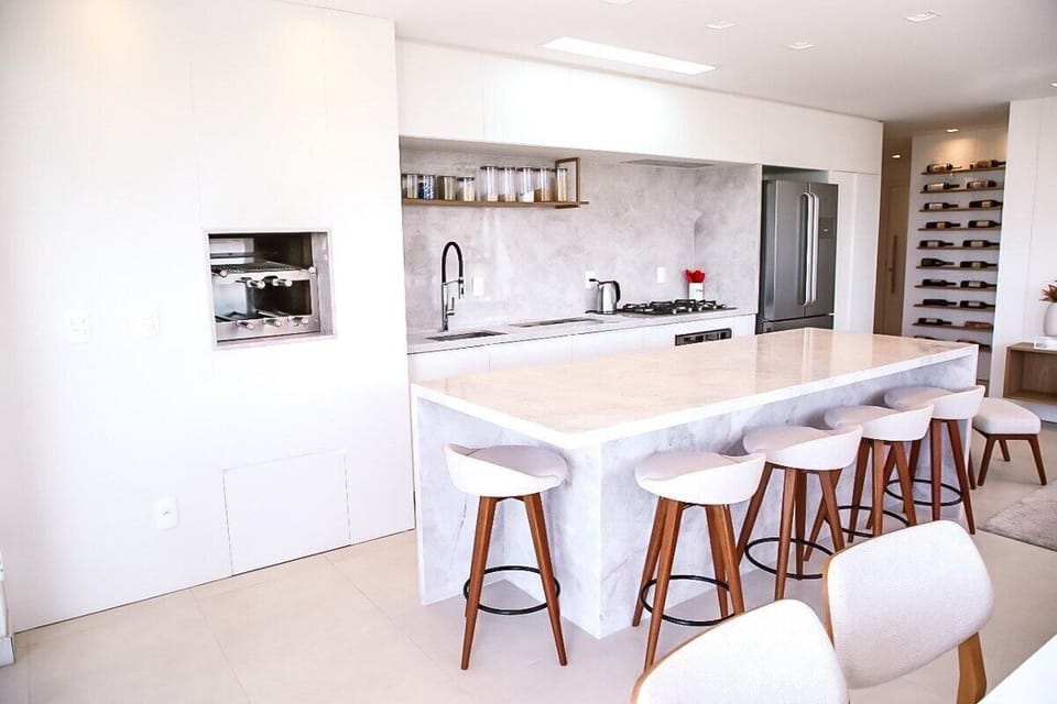 Deluxe Apartment, Pool Access, Beach View | Private kitchen | Fridge, microwave, cookware/dishes/utensils, dining tables
