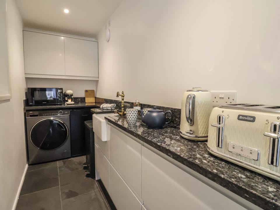 Fridge, electric kettle, cookware/dishes/utensils