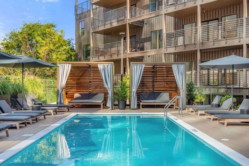 Community Pool w/ cabanas and lounge chairs