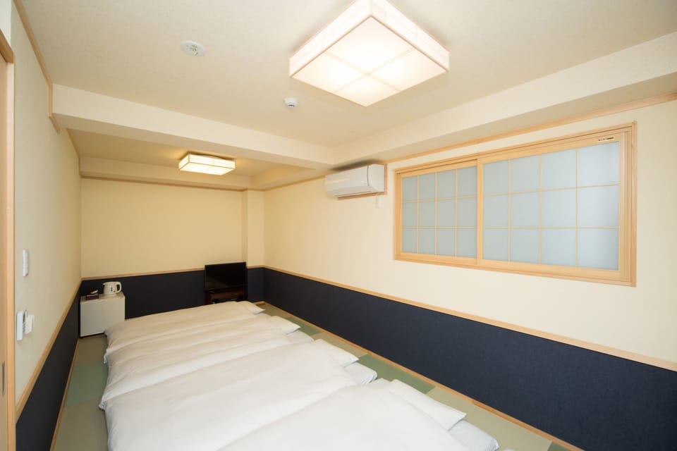 Deluxe Room, Non Smoking (Japanese-Style) | Down comforters, in-room safe, individually decorated, desk