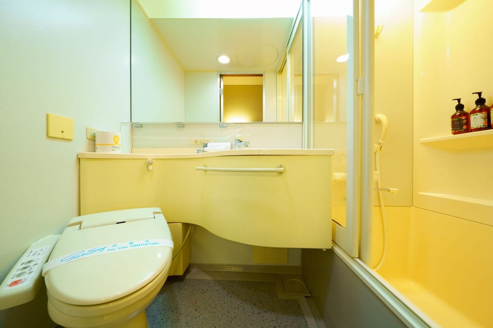 Shower, free toiletries, hair dryer, slippers