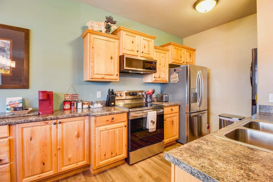 Full kitchen with plenty of counterspace and stainless appliances