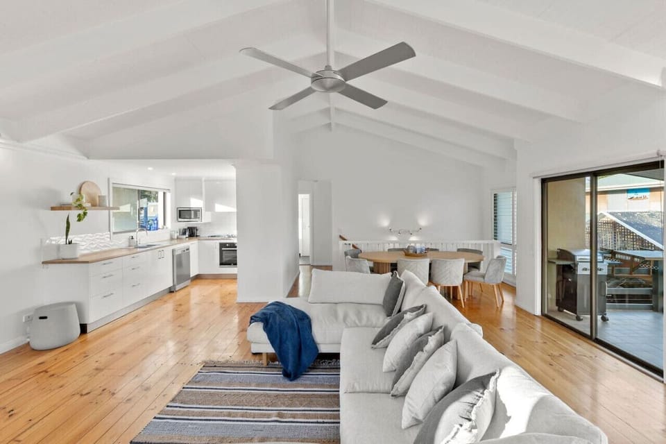 Open-Plan Living – Light-filled and airy with soaring ceilings, timber floors, and a coastal palette that feels like home.