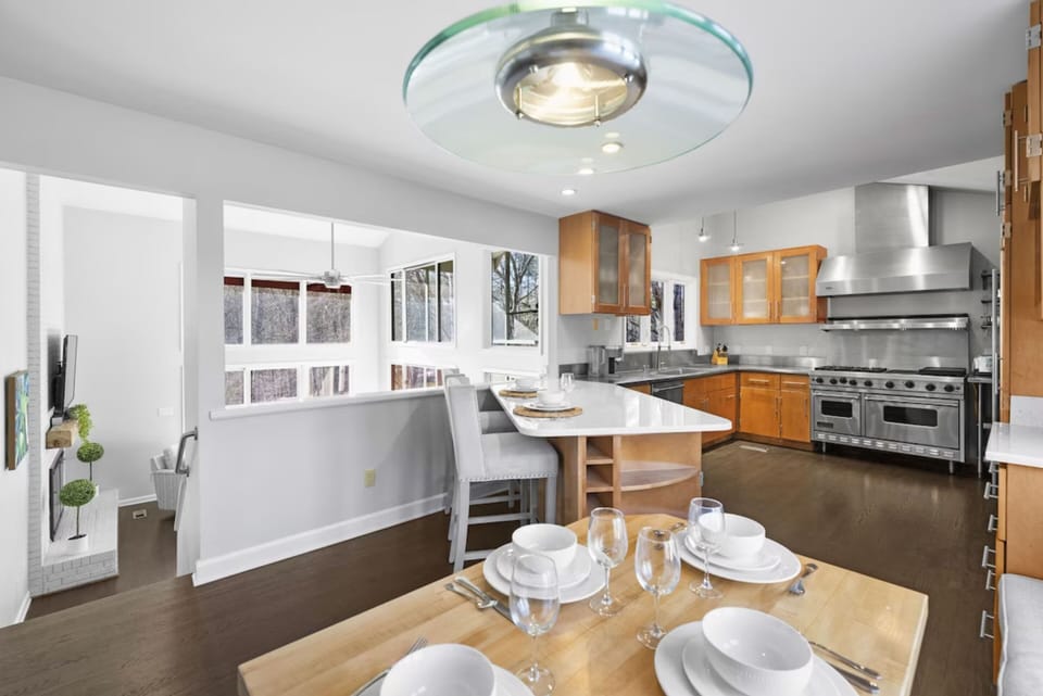 Fully stocked gourmet kitchen with bar.