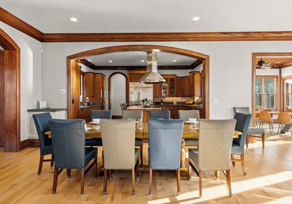 Gather everyone around the primary dining table—an inviting Lake Norman setting made for long dinners, laughter, and easy hosting.