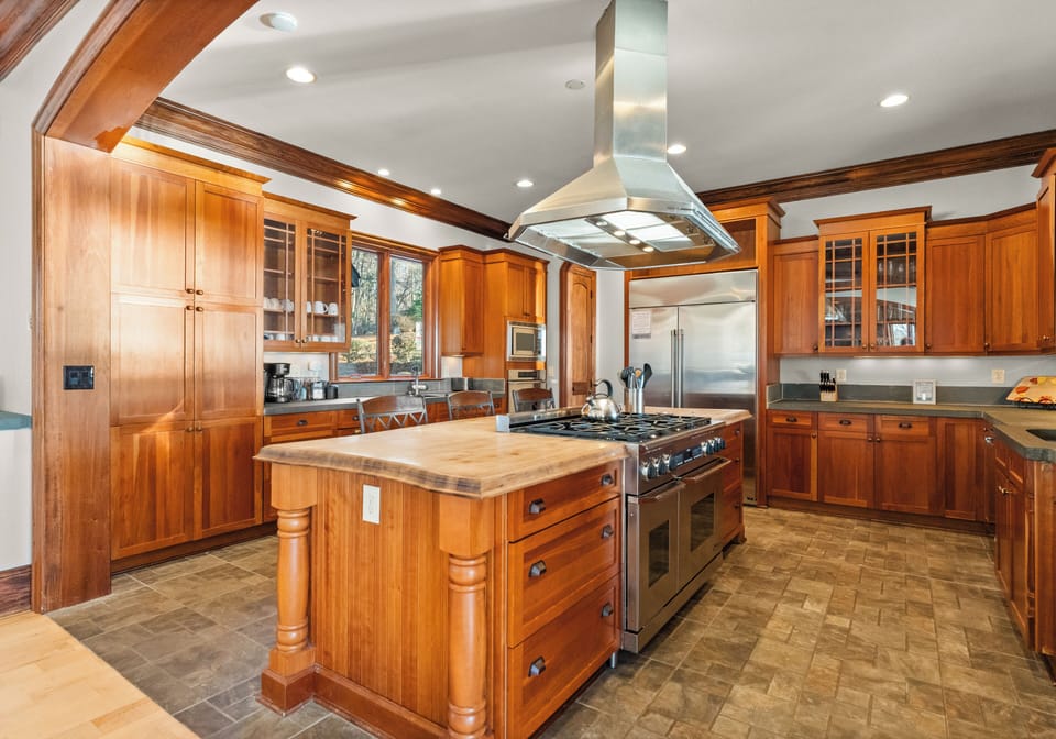 Gorgeous kitchen - lots of counter space, bar seating. Viking appliances for all the chefs in your crew!