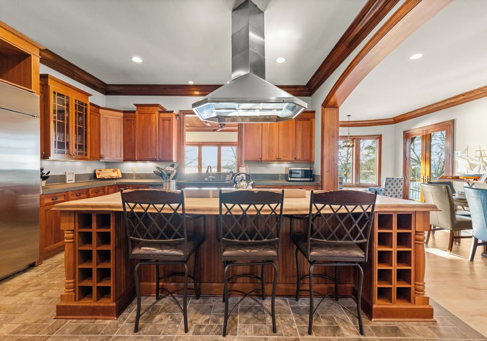 Gorgeous kitchen - lots of counter space, bar seating. Viking appliances for all the chefs in your crew!