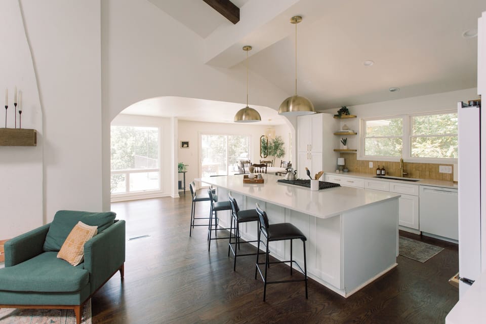 Large white kitchen island with a seating capacity of 6.