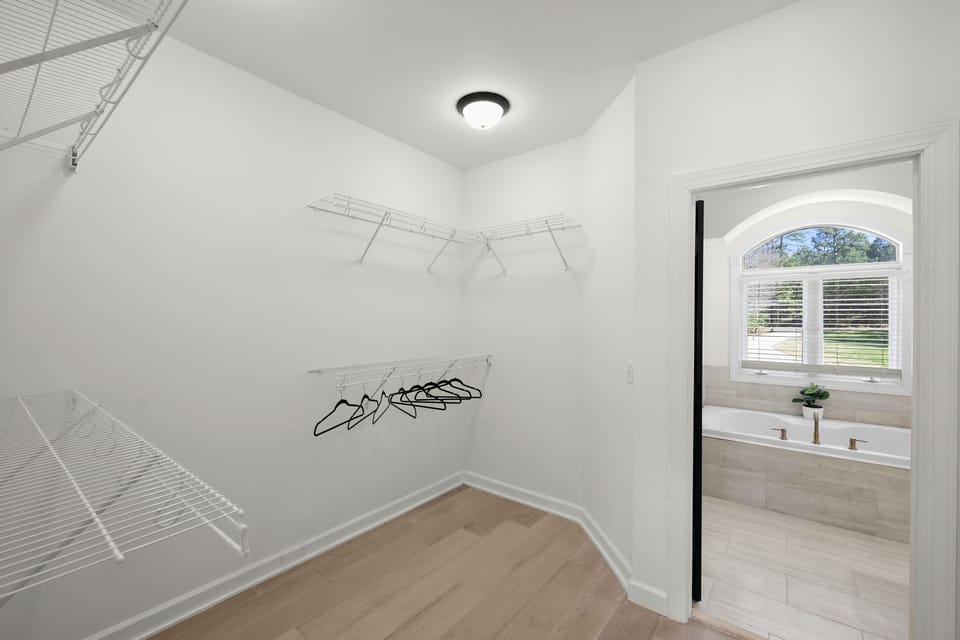 Walk-in closet in the primary bedroom.