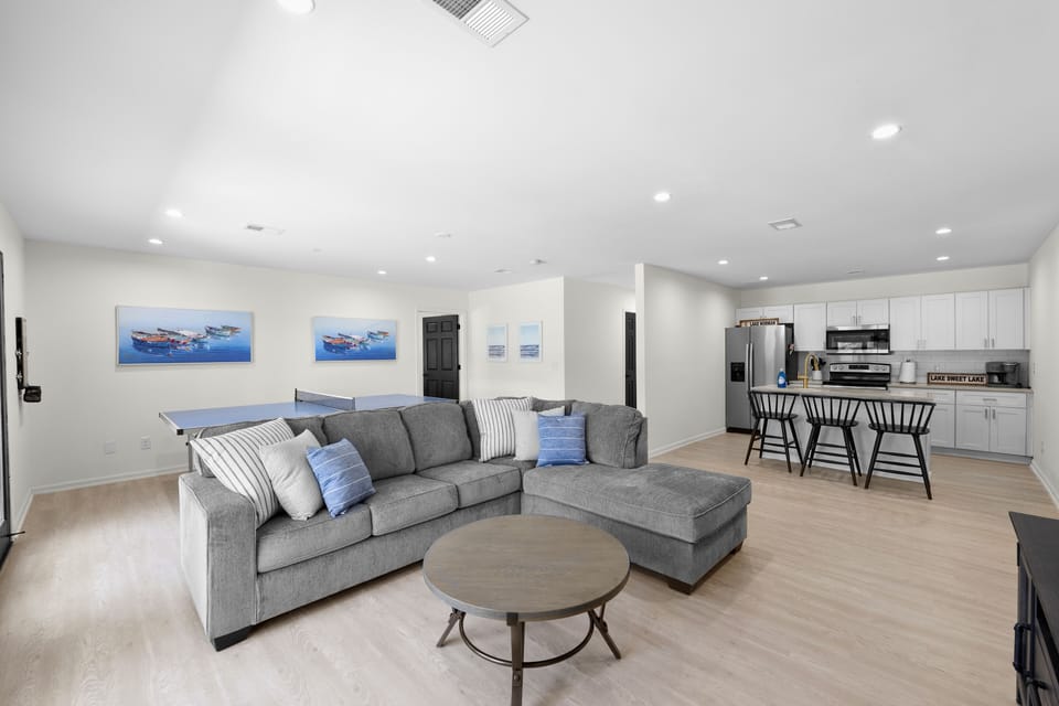 Lower Level living room with ping pong and second kitchen.