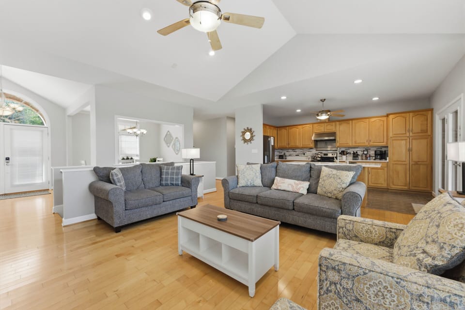 Open concept main level with kitchen, living and dining areas all together. 