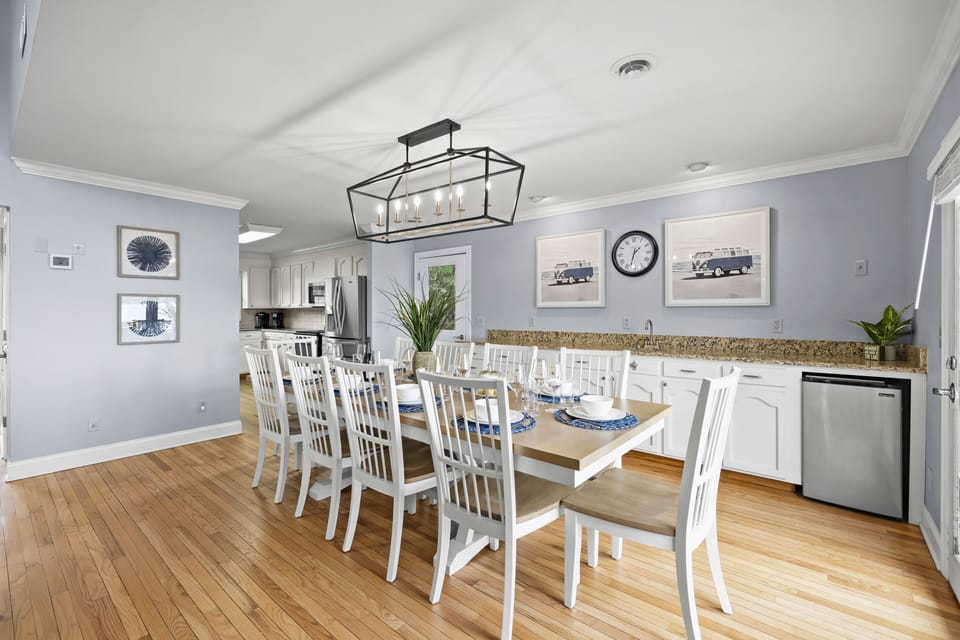 The dining space offers a built-in buffet area, with a bar sink and mini fridge.