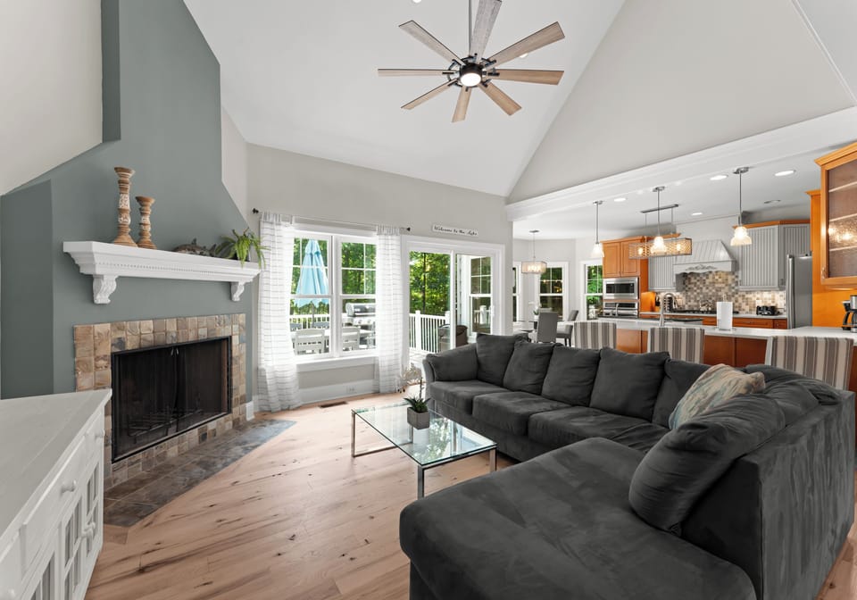 Comfortable living room, high ceilings with large sectional couch.