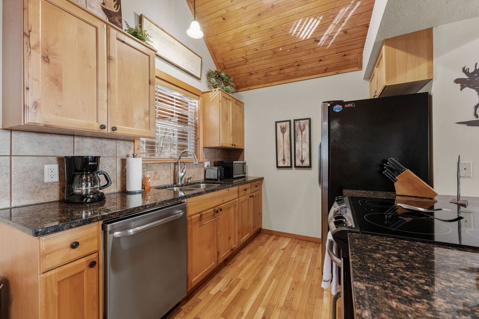 The kitchen includes all the appliances and utensils you need for a great meal. 