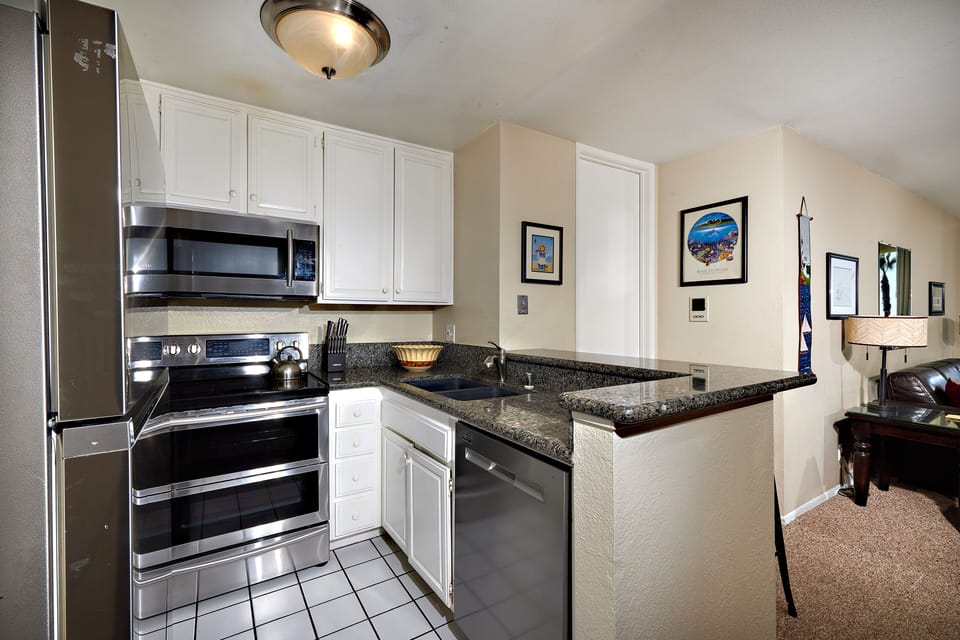 fully equipped kitchen with stainless steel appliances
