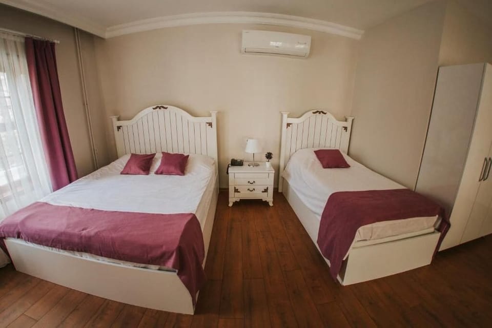 Deluxe Triple Room, Non Smoking, River View | Minibar, WiFi (free), bed sheets