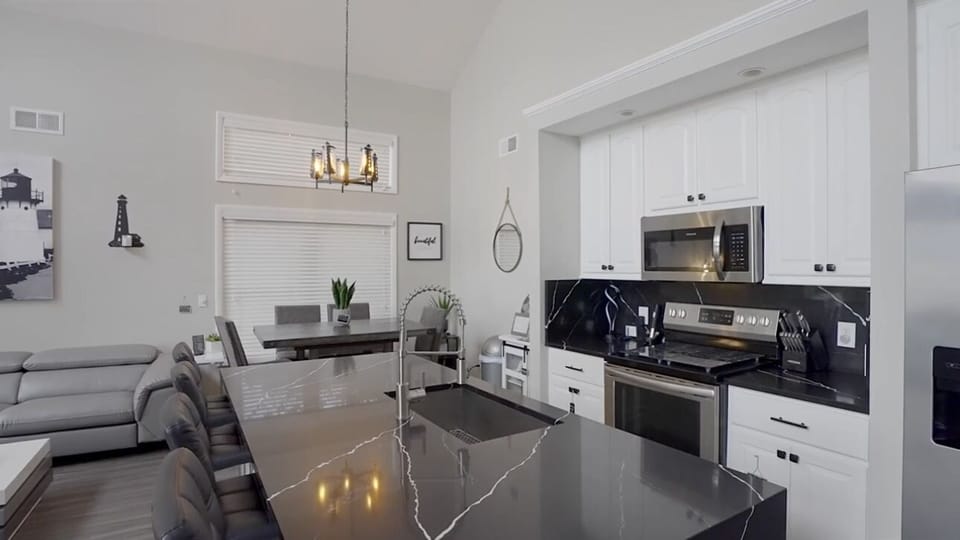 Kitchen with Refrigerator, Microwave, stove and Dishwasher.