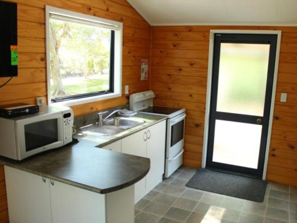 Two Bedroom Unit | Private kitchen | Shared fridge, microwave, highchair