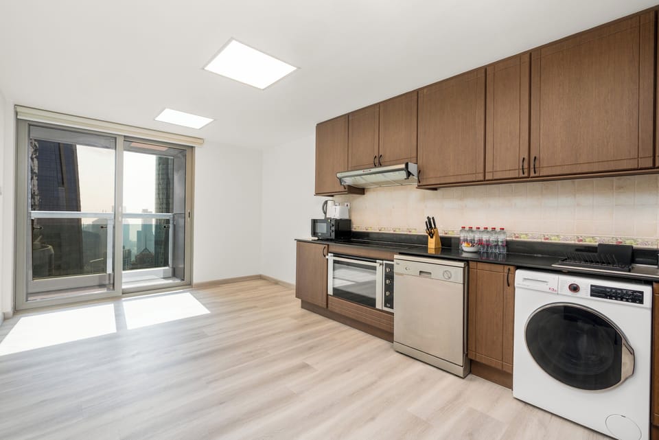 Panoramic Apartment | Private kitchen | Full-size fridge, microwave, oven, stovetop