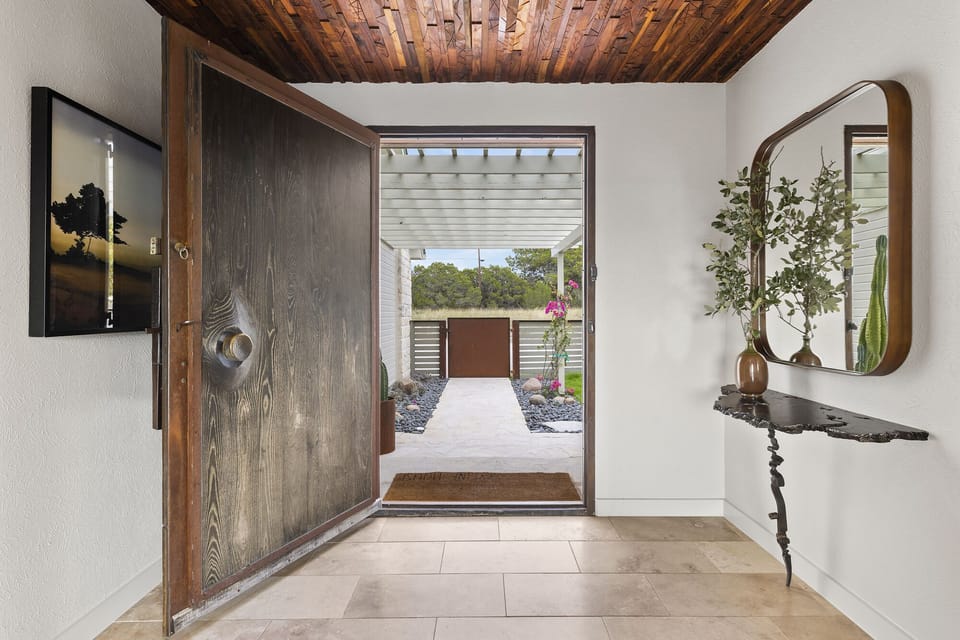 Entryway introducing you to the custom woodwork throughout the property
