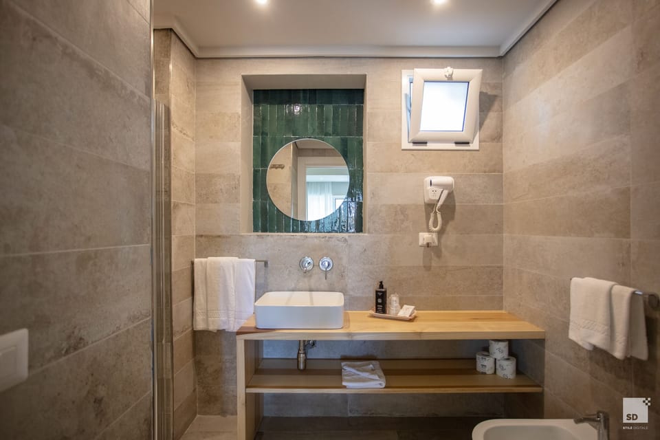 Shower, free toiletries, hair dryer, towels