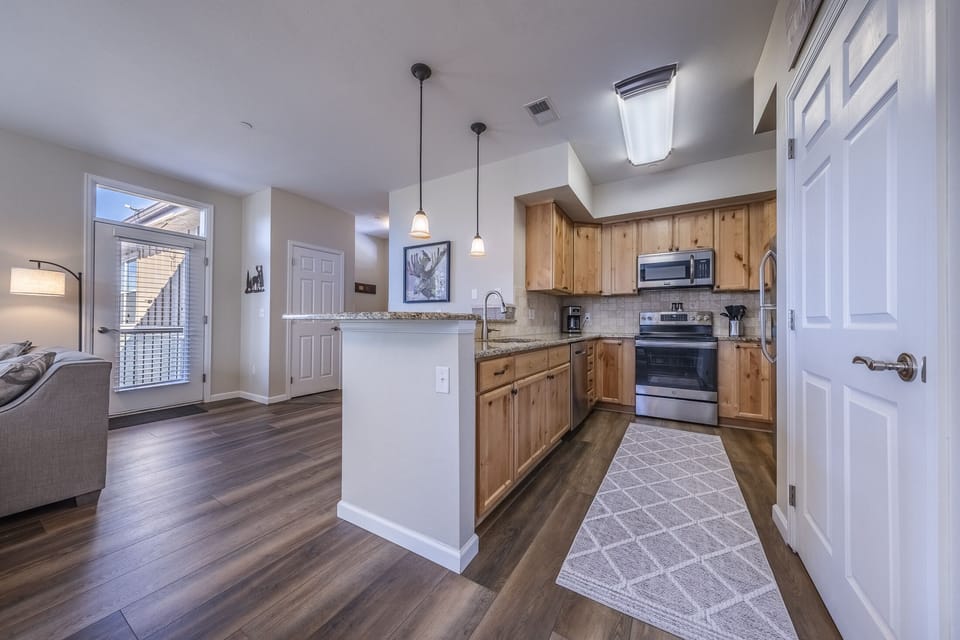 Kitchen - Open kitchen with stainless steel appliances & granite countertops