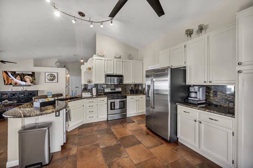 Whip up feasts in this fully equipped kitchen! Enjoy a 4-burner oven, microwave, Samsung dishwasher, fridge (plus extra in garage!), Keurig, toaster, waffle maker, griddle, rice cooker, and blender. Culinary adventures await!
