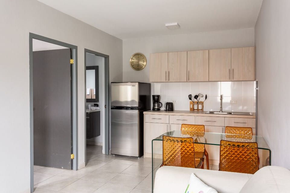 Fully equipped kitchen with basic cooking items, electric stove (in the cabinet)