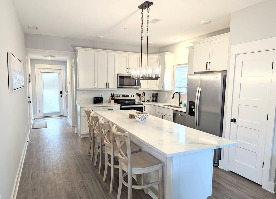 Enter into the spacious kitchen with extended island