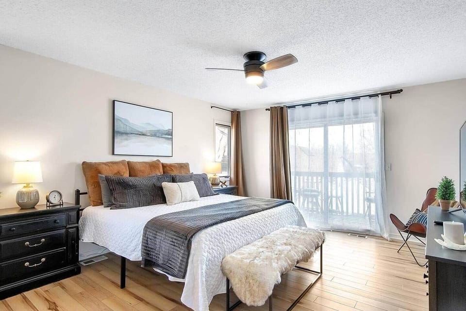 Master Bedroom (in the loft area) with private patio, comfy king size bed with hybrid mattress, vanity/ desk, Smart TV and plenty of space