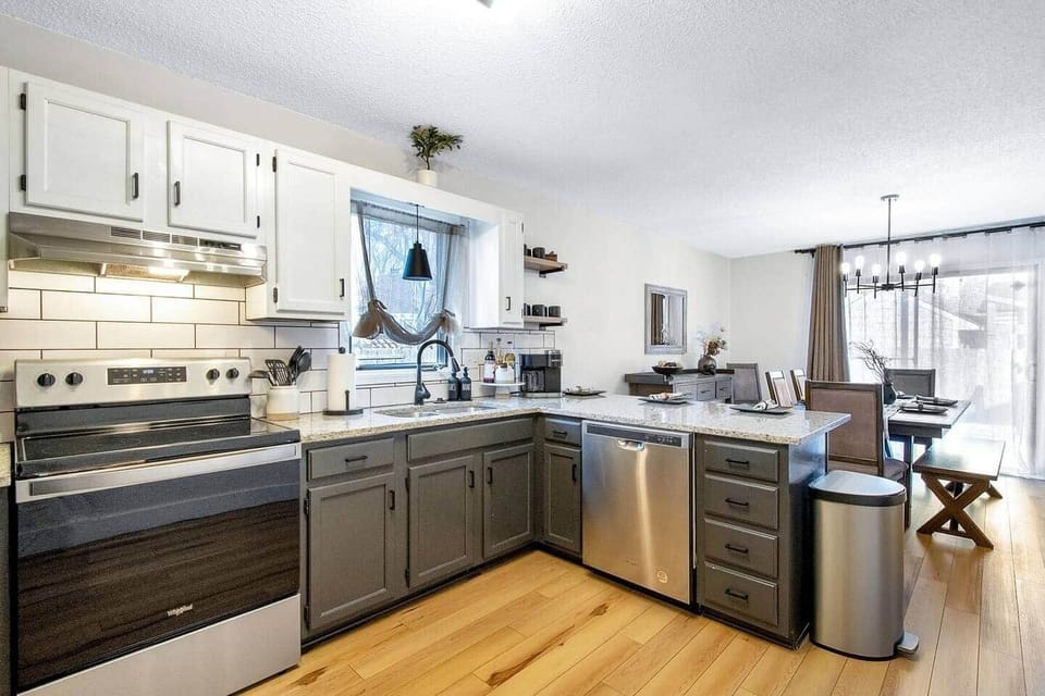 Full kitchen with Keurig duo coffee maker, refrigerator with ice maker and water dispenser, stainless steel range.  Equipped with bakeware, cookware, dinnerware, silverware and plenty of cups, glasses and coffee cups. 
