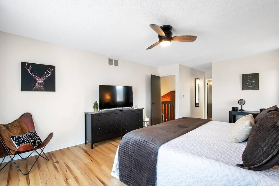 Master Bedroom (in the loft area) with private patio, comfy king size bed with hybrid mattress, vanity/ desk, Smart TV and plenty of space