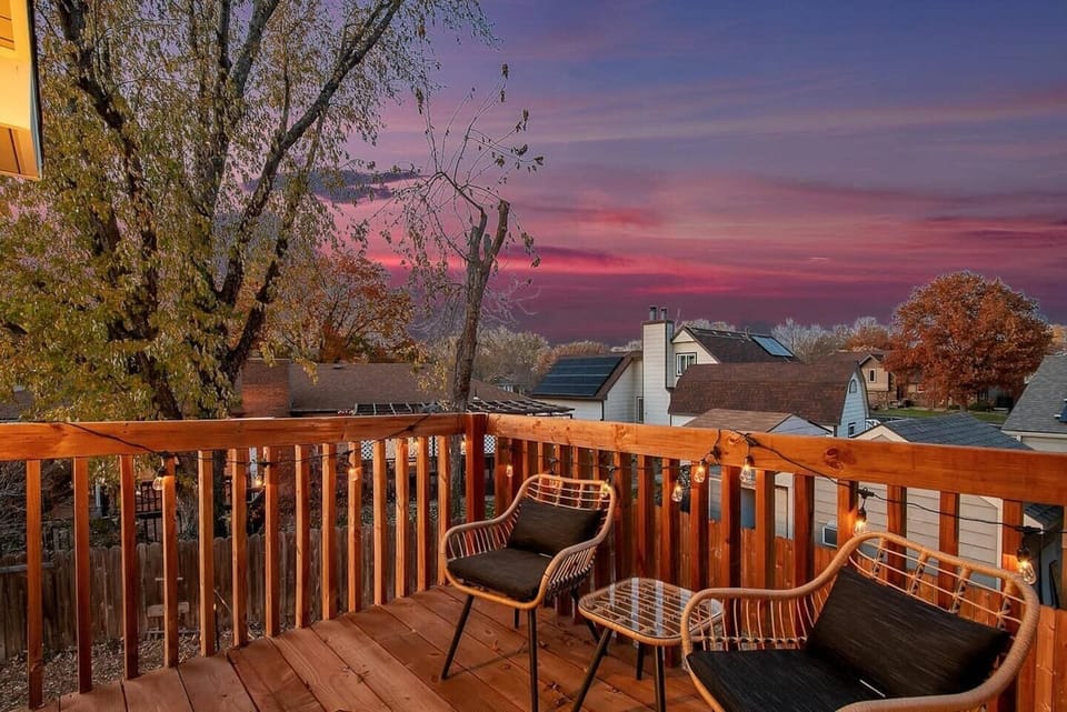 Private patio off master bedroom with cozy seating and lighting