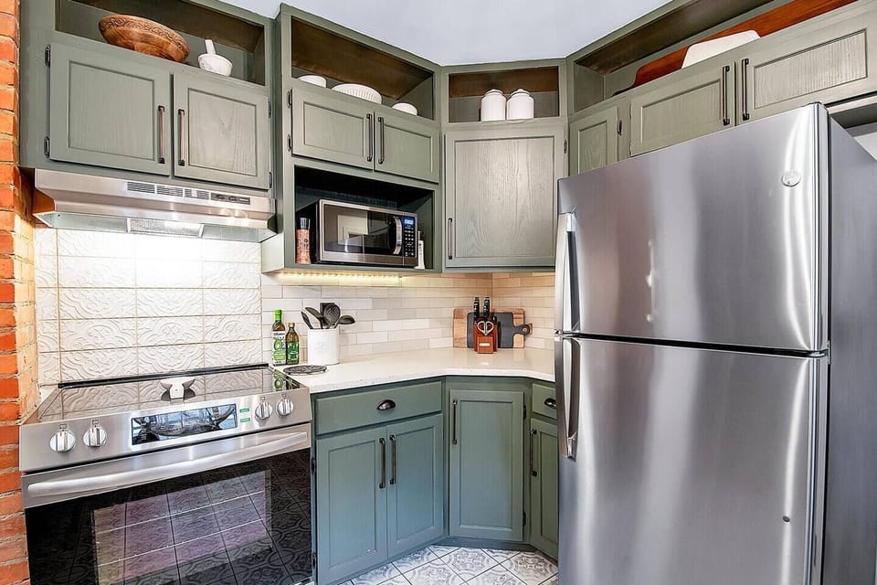 Beautiful kitchen with  quartz countertops, new appliances, under cabinet lighting (that changes colors!), bar and tons of storage!