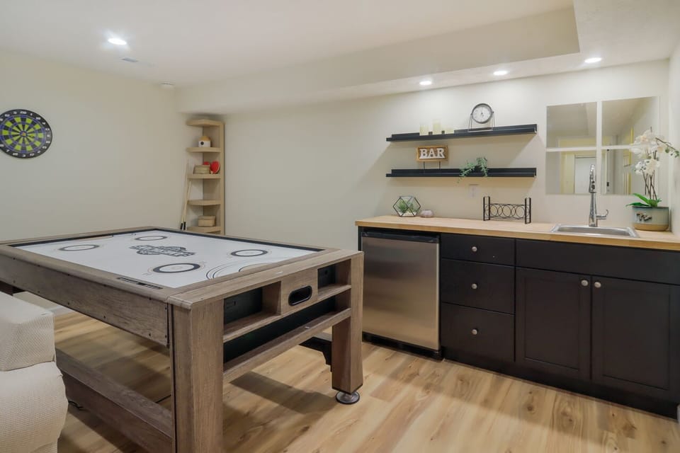 Game table in basement converts to Air hockey, Pool, or Ping Pong 