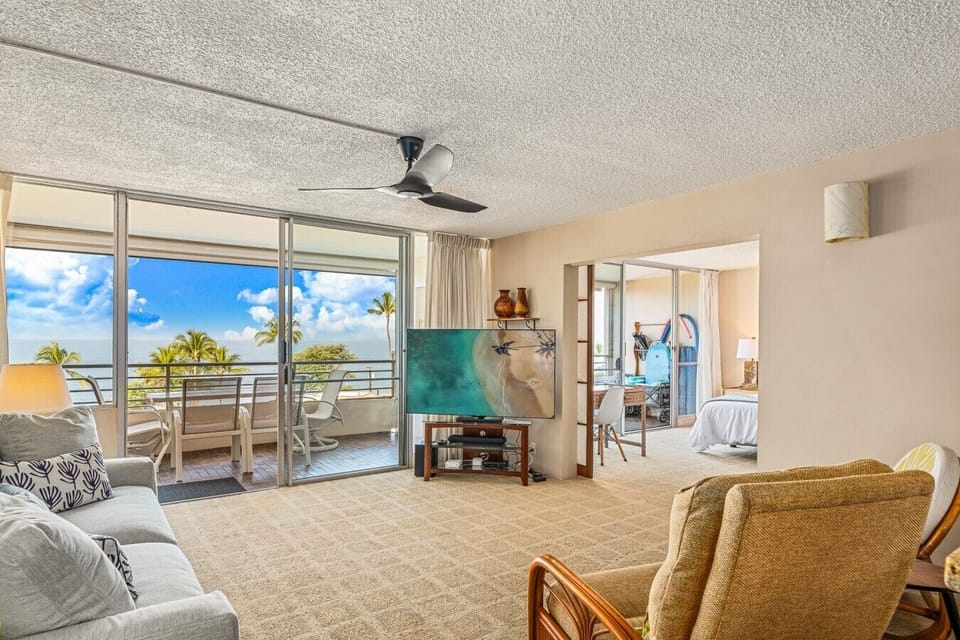 Living room with sweeping ocean views and access to double-size lanai