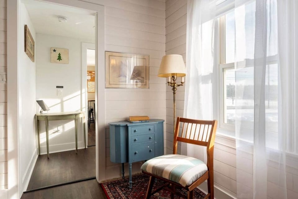 Old carriage house area converted into beautiful & cozy living room with 70" TV