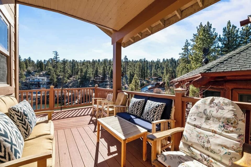 Upper deck back of home. Access from the kitchen. Views Boulder Bay Park and inlet. Gas grill, ice chest, and patio furniture.