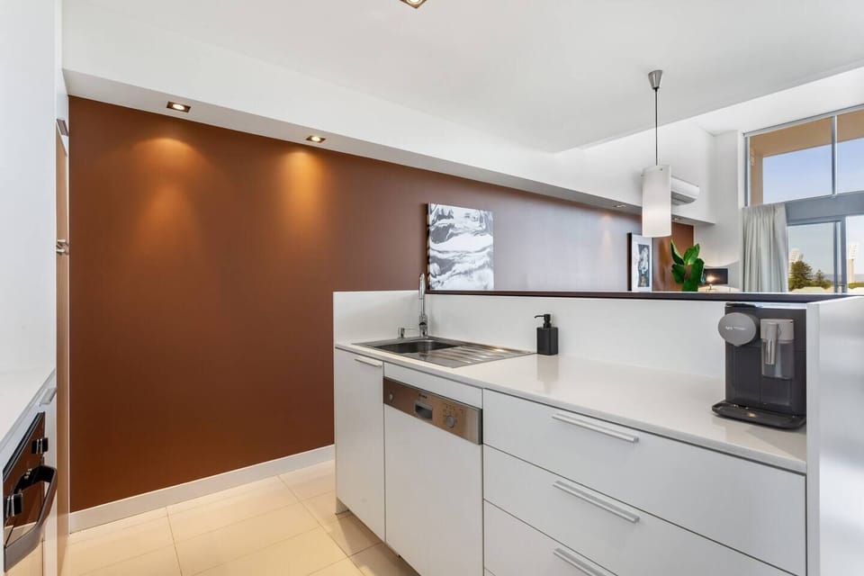 Clean lines and warm tones create a welcoming kitchen environment, with everything you need within easy reach.
