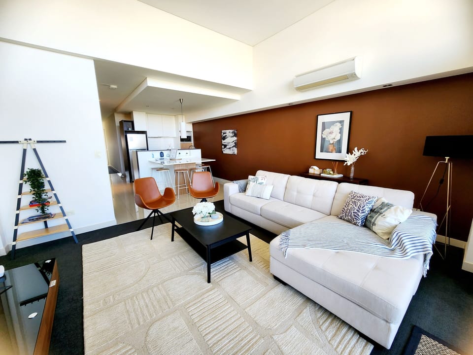 Spacious living room with high ceiling being on the top floor