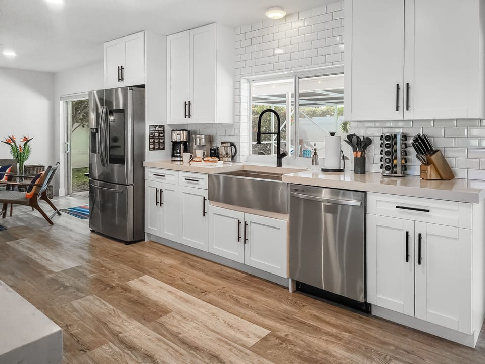 Smart stainless appliances, coffee station, beverage fridge round out the functional luxury.
