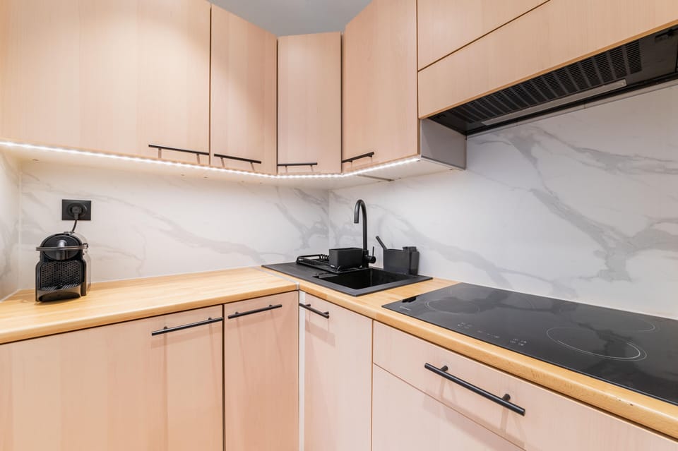Nespresso machine, toaster, induction hob, oven and washing machine.