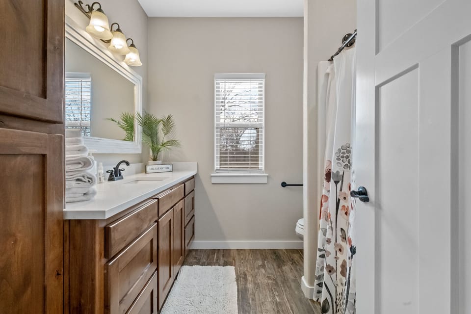 Guest bathroom located in the hallway shared by bedrooms 2 & 3!