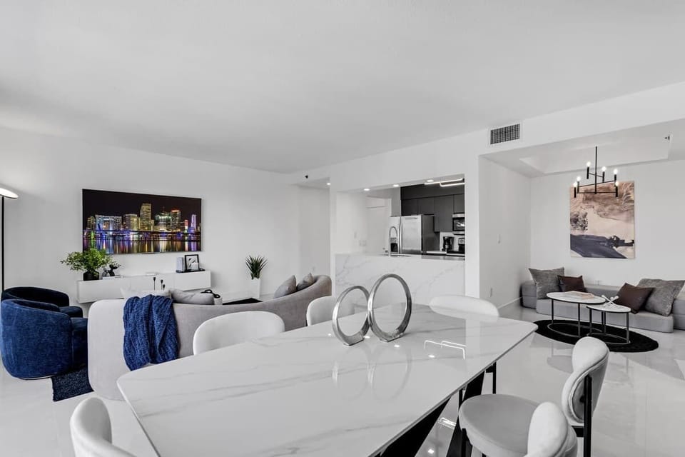Large dining room table comfortably accommodates 6 people.