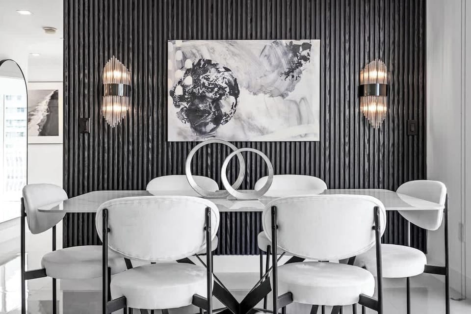 Large dining room table comfortably accommodates 6 people.