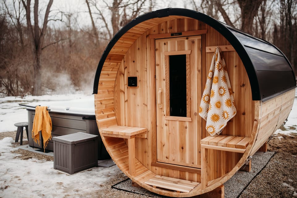 10 foot long cedar barrel sauna for six. Heats up in 10–15 minutes.