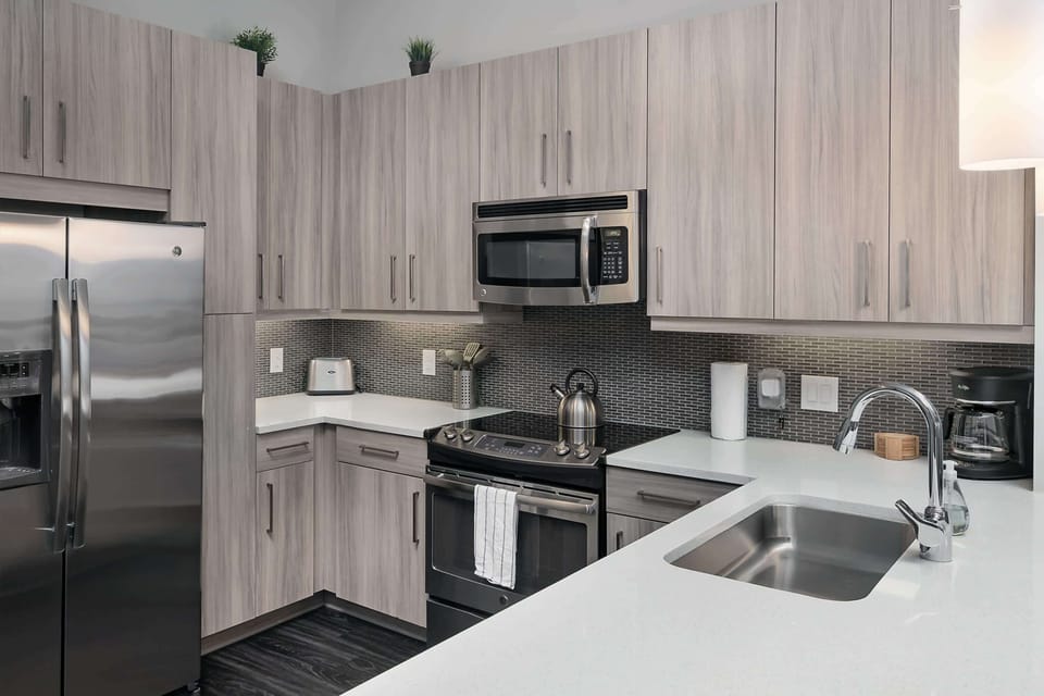 Fully stocked kitchen with cooking essentials and dining table
