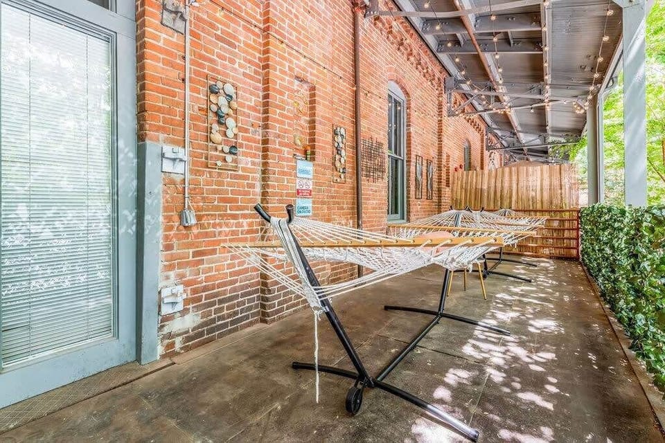 Private Balcony with 2 hammocks, table, & string lights