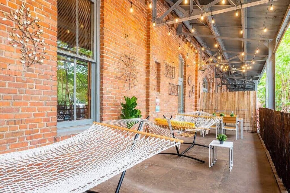 Private Balcony with 2 hammocks, table, & string lights