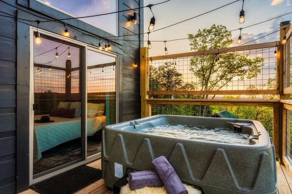 Indulge in luxury  where a  hot tub awaits with a panoramic view
